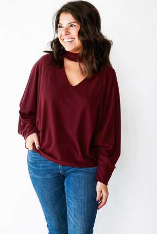 CUT OUT NECK TOP WITH BAT WING SLEEVES